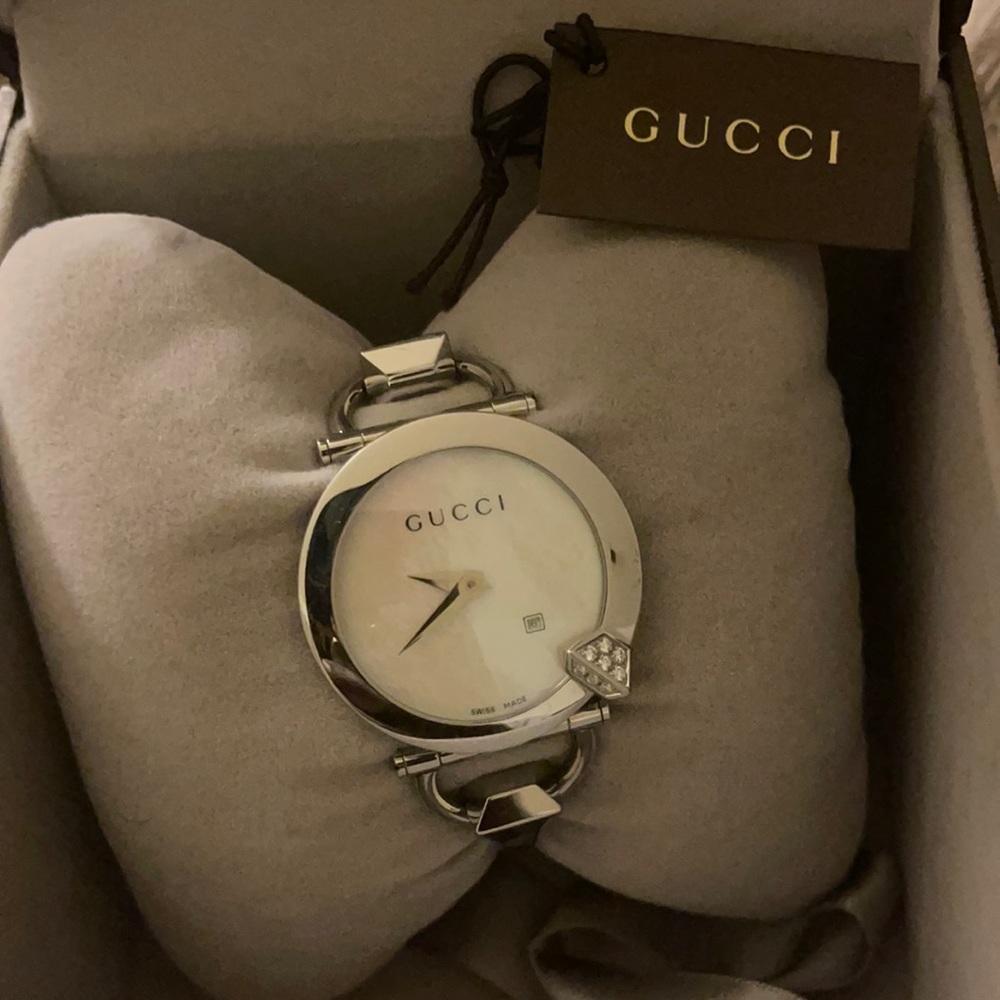 Authentic bold Gucci watch, Swiss made, gently use, in original box